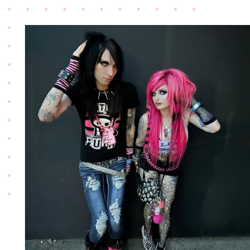 photo of two people dressed in black and wearing punk-like clothes