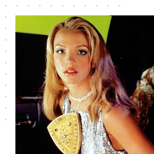 Britney Spears from the 90s looking at the camera before preforming a concert